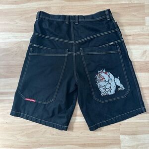 Black JNCO skater shorts with embroidered bulldog on back pocket